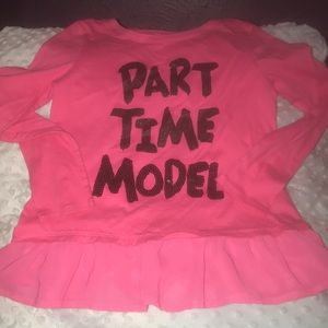 Pink sparkly shirt with ruffle at the bottom